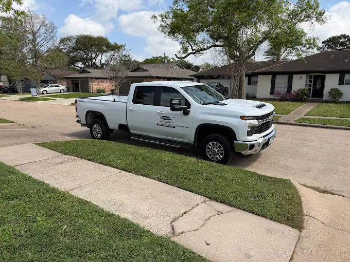 Leatherwood Lawn Specialists service truck in Houston TX | commercial landscaping, lawn care, lawn maintenance, drainage, concrete, outdoor solutions near Houston TX Leatherwood Lawn Specialists service truck in Houston TX
